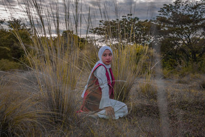 Portrait of girl on field