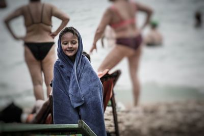 Close-up of happy girl standing at beach
