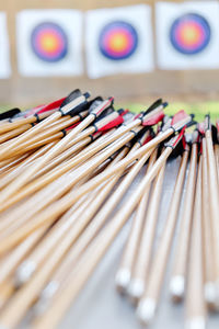 Close-up of arrows on table