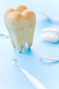 Close-up of artificial tooth on table