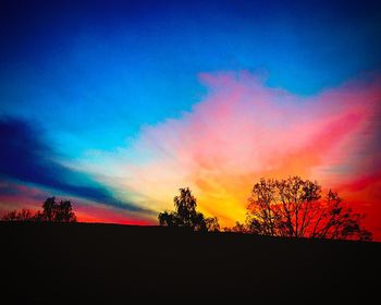 Scenic shot of silhouette landscape against sky at sunset