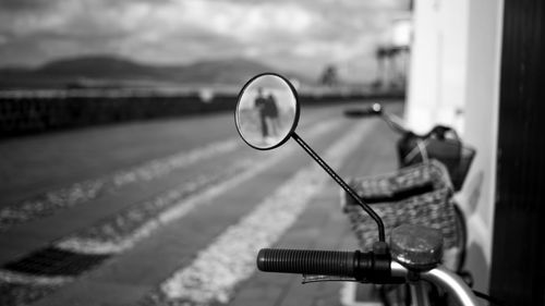 Close-up of bicycle wheel against sky