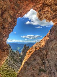 Scenic view of sea and mountains against sky