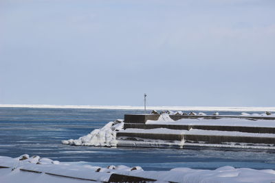 Scenic view of sea against sky during winter