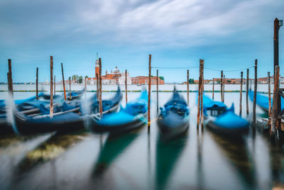 Boats moored in canal