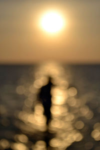 Blurred motion of sea against sky during sunset