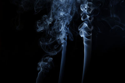 Close-up of cigarette against black background