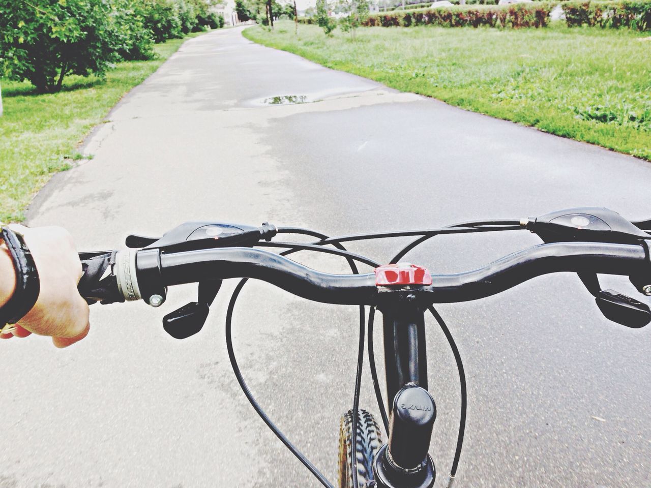 bicycle, low section, transportation, part of, lifestyles, person, road, leisure activity, street, land vehicle, riding, cropped, shoe, grass, unrecognizable person, cycling, personal perspective