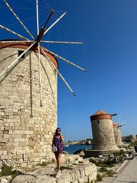 Low angle view of man standing against building