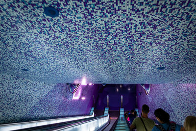 People in illuminated subway