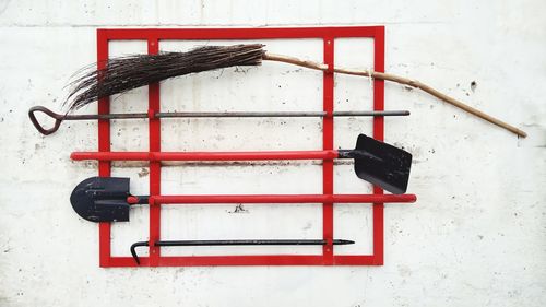 Close-up of red mailbox on wall