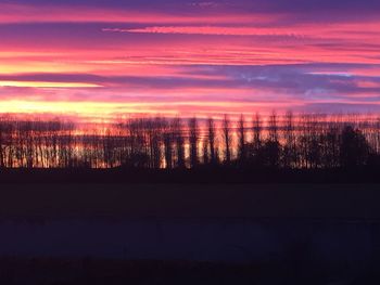 Scenic view of silhouette landscape against sky during sunset