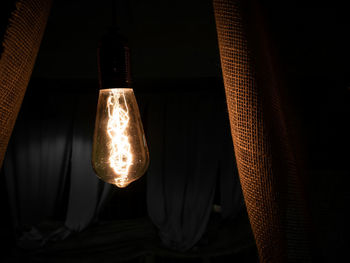 Close-up of illuminated light bulb