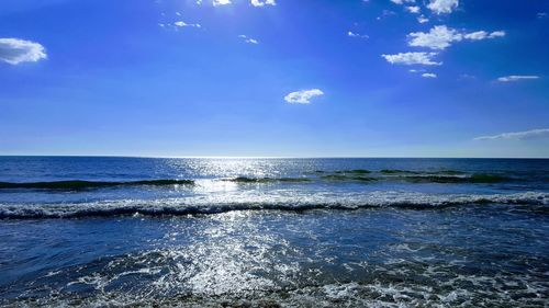 Scenic view of sea against blue sky