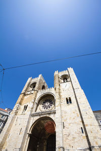 Low angle view of building against blue sky