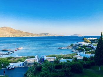 High angle view of sea against clear blue sky