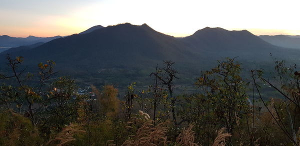 Scenic view of mountains against sky during sunset