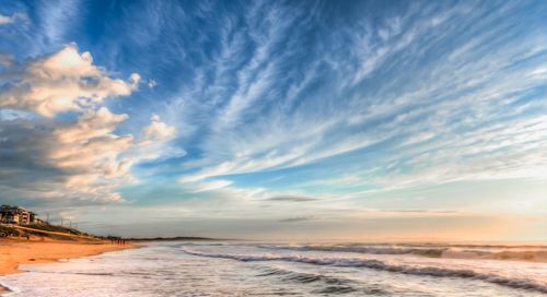 Scenic view of sea against cloudy sky