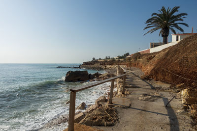 Scenic view of beach against clear sky