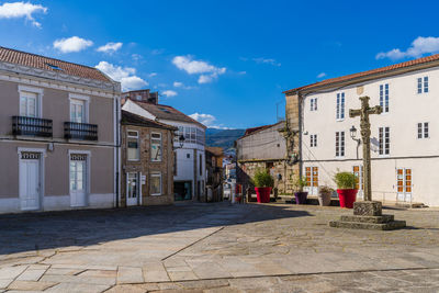 Buildings in city against sky