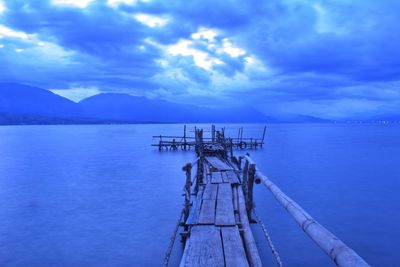 Pier over sea against sky