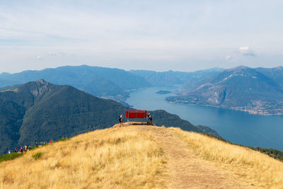 The big red bench placed on the mountain in a panoramic position