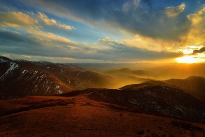 Scenic view of mountains against sky during sunset