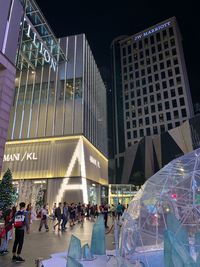 Group of people in modern building at night