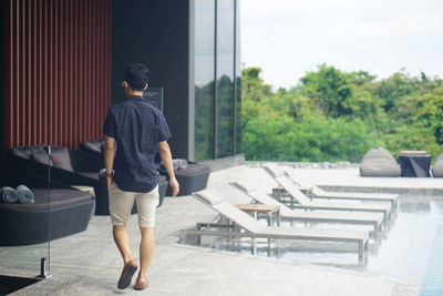 Full length rear view of woman walking outdoors