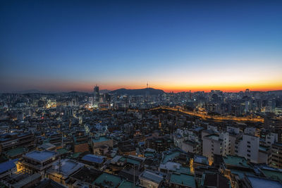 Sunset view over seoul city with view of n seoul tower. taken from changsindong, seoul, south korea.