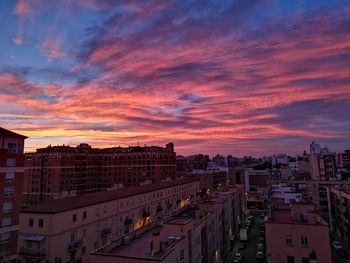 High angle view of illuminated buildings against sky during sunset
