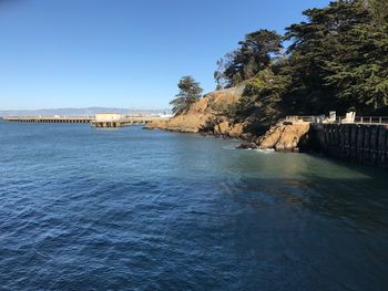 Scenic view of sea in front of clear blue sky