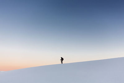 Silhouette man against clear sky