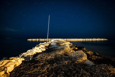 Scenic view of sea against sky at night