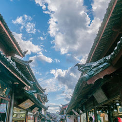 Low angle view of buildings against sky in city