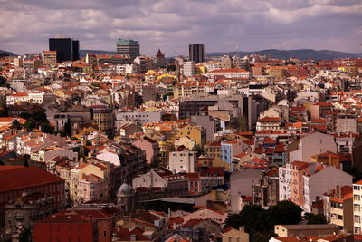 Cityscape against cloudy sky