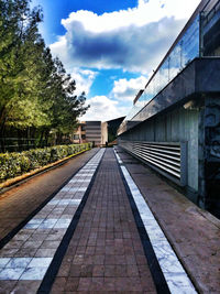 Railroad track against cloudy sky