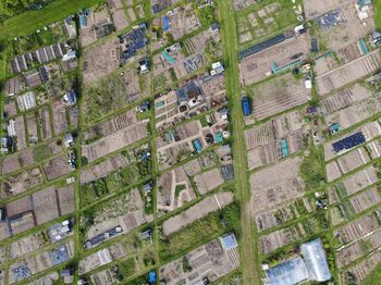 High angle view of buildings in field