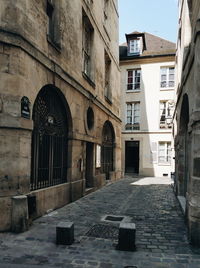 Alley amidst residential buildings