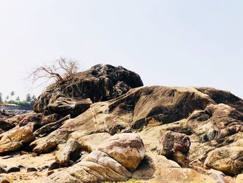 Rock formation on land against clear sky