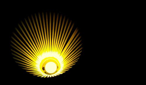 Close-up of lit lamp in dark room