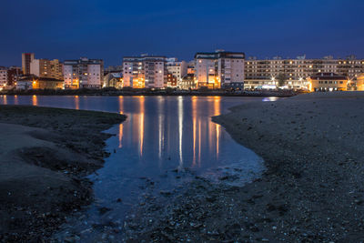 View of city lit up at night