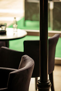 Close-up of empty chairs and table in restaurant