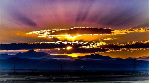 Scenic view of dramatic sky during sunset