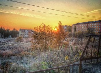 Silhouette of built structure against sunset sky