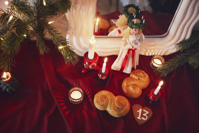 Christmas candles and saffron buns for st. lucia day