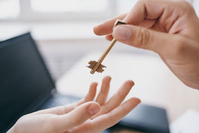 Close-up of person hand holding mobile phone