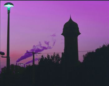 Low angle view of silhouette street light at night