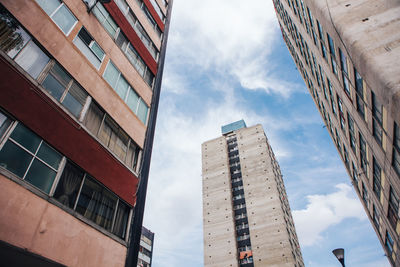 Low angle view of modern buildings against sky