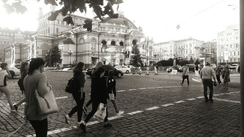 People walking on street in city